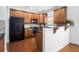 Modern kitchen featuring stainless steel appliances and rich wood cabinetry at 1935 Cobblestone Ne Cir, Brookhaven, GA 30319