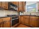 Well-equipped kitchen featuring granite countertops, tile backsplash, and modern appliances at 1935 Cobblestone Ne Cir, Brookhaven, GA 30319