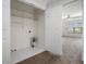 Convenient laundry closet adjacent to the bedroom, featuring shelving and hookups at 1935 Cobblestone Ne Cir, Brookhaven, GA 30319
