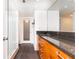 Modern bathroom with a granite countertop, wooden cabinets, and a glass-enclosed shower at 199 14Th Ne St # 412, Atlanta, GA 30309