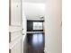 View of the bedroom featuring hardwood floors, and black accent wall at 199 14Th Ne St # 412, Atlanta, GA 30309