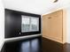 Bedroom with hardwood floors, accent wall, and a convenient murphy bed at 199 14Th Ne St # 412, Atlanta, GA 30309
