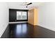 Bedroom with hardwood floors, accent wall, and a convenient murphy bed at 199 14Th Ne St # 412, Atlanta, GA 30309