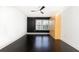Bedroom with hardwood floors, accent wall, and a convenient murphy bed at 199 14Th Ne St # 412, Atlanta, GA 30309