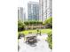 Community courtyard offers patio seating and manicured greenspace at 199 14Th Ne St # 412, Atlanta, GA 30309