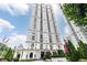 Luxury high-rise building featuring an elegant facade, manicured landscaping, and a welcoming entrance at 199 14Th Ne St # 412, Atlanta, GA 30309