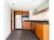 Bright kitchen features stainless appliances, wood cabinets, black countertops, and recessed lighting at 199 14Th Ne St # 412, Atlanta, GA 30309