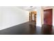 Modern living room area with hardwood floors leading to kitchen with wood cabinets and stainless steel appliances at 199 14Th Ne St # 412, Atlanta, GA 30309