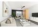 Bright living room with stylish decor, seating, and a modern ceiling fan at 199 14Th Ne St # 412, Atlanta, GA 30309