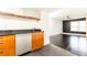 Well lit kitchen area leading to a living room with ceiling fan and a large window at 199 14Th Ne St # 412, Atlanta, GA 30309