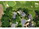 Aerial view of neighborhood near golf course with mature trees and winding roads at 2202 Lattimore Farm Nw Dr, Kennesaw, GA 30152