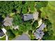 Aerial view of estate showing mature trees and neighborhood near a golf course at 2202 Lattimore Farm Nw Dr, Kennesaw, GA 30152