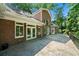 The backyard patio of the house, showcasing a stone patio and brick exterior at 2202 Lattimore Farm Nw Dr, Kennesaw, GA 30152