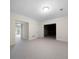 Spacious basement features neutral carpet, white trim, and natural lighting at 2202 Lattimore Farm Nw Dr, Kennesaw, GA 30152