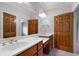 Bathroom with double sink vanity, and wallpaper at 2202 Lattimore Farm Nw Dr, Kennesaw, GA 30152
