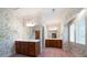 Bright bathroom featuring dual vanities, floral wallpaper, and a window at 2202 Lattimore Farm Nw Dr, Kennesaw, GA 30152