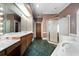 Bathroom featuring double sinks, a large mirror, and a glass-enclosed shower at 2202 Lattimore Farm Nw Dr, Kennesaw, GA 30152