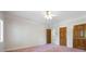 Bright bedroom with a ceiling fan, multiple doors, and window at 2202 Lattimore Farm Nw Dr, Kennesaw, GA 30152