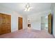 Spacious bedroom featuring a ceiling fan, crown molding and multiple doors at 2202 Lattimore Farm Nw Dr, Kennesaw, GA 30152