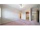 Spacious bedroom with crown molding, doors and ceiling fan at 2202 Lattimore Farm Nw Dr, Kennesaw, GA 30152