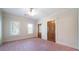 A cozy bedroom with crown molding, ceiling fan, and natural light from the windows at 2202 Lattimore Farm Nw Dr, Kennesaw, GA 30152