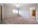 Bright bedroom with a ceiling fan, window, and doorway at 2202 Lattimore Farm Nw Dr, Kennesaw, GA 30152