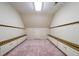Spacious bonus room featuring built-in storage cabinets and unique wall-mounted racks at 2202 Lattimore Farm Nw Dr, Kennesaw, GA 30152