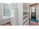 Custom closet with built-in shelving and drawers at 2202 Lattimore Farm Nw Dr, Kennesaw, GA 30152