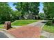 Stately brick home with well-maintained landscaping, a brick mailbox, and a paved driveway at 2202 Lattimore Farm Nw Dr, Kennesaw, GA 30152