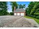 Spacious three-car garage with ample parking space and well-maintained landscaping at 2202 Lattimore Farm Nw Dr, Kennesaw, GA 30152