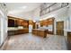 Expansive kitchen with island, custom cabinetry, and modern appliances with staircase access at 2202 Lattimore Farm Nw Dr, Kennesaw, GA 30152