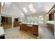 Spacious kitchen with island, patterned tile flooring, and bright natural light at 2202 Lattimore Farm Nw Dr, Kennesaw, GA 30152