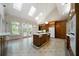Bright kitchen with island, tile floors, and ample windows providing natural light at 2202 Lattimore Farm Nw Dr, Kennesaw, GA 30152