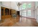 Spacious living room with high ceilings, a fireplace, built-in shelves, and large windows at 2202 Lattimore Farm Nw Dr, Kennesaw, GA 30152