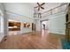 Open living room showcasing hardwood floors, fireplace, and access to the upper level at 2202 Lattimore Farm Nw Dr, Kennesaw, GA 30152