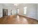 Bright living room featuring hardwood floors and white trim at 2202 Lattimore Farm Nw Dr, Kennesaw, GA 30152