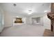 Open-concept living room with recessed lights, fireplace, and an adjacent bar area at 2202 Lattimore Farm Nw Dr, Kennesaw, GA 30152