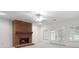 Cozy living room with fireplace, white trim, and access to the backyard through double doors at 2202 Lattimore Farm Nw Dr, Kennesaw, GA 30152