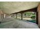 Covered brick patio offering ample outdoor living space at 2202 Lattimore Farm Nw Dr, Kennesaw, GA 30152