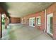 Covered patio with brick arches and access to the backyard at 2202 Lattimore Farm Nw Dr, Kennesaw, GA 30152