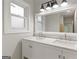 Well-lit bathroom featuring double sinks, modern fixtures, and ample counter space at 2544 Overlook Dr, Atlanta, GA 30344
