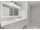Beautiful bathroom featuring double sinks, a large mirror with modern lighting, and stylish countertops at 2544 Overlook Dr, Atlanta, GA 30344