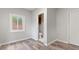 A cozy bedroom with hardwood floors adjacent to a renovated powder room and double-doored closet at 2544 Overlook Dr, Atlanta, GA 30344