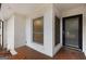 Covered entryway featuring tiled flooring, a modern door, and brick walls for a stylish welcome at 2544 Overlook Dr, Atlanta, GA 30344