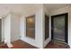 Close-up of a freshly painted brick entryway, featuring a secured screen door and allowing natural light in at 2544 Overlook Dr, Atlanta, GA 30344