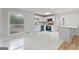 Bright kitchen with white cabinets, stainless steel appliances, and a marble-top breakfast bar at 2544 Overlook Dr, Atlanta, GA 30344