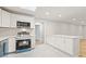 Bright eat-in kitchen featuring white cabinets, quartz countertops, and stainless steel appliances at 2544 Overlook Dr, Atlanta, GA 30344