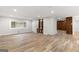 Bright and airy living room featuring wood floors, built-in shelving, and fresh paint at 2544 Overlook Dr, Atlanta, GA 30344