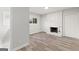 Bright living room features a cozy fireplace with brick surround and hardwood flooring at 2544 Overlook Dr, Atlanta, GA 30344