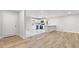 An open-concept living space with a modern kitchen, sleek marble countertops, and light wood-look floors at 2544 Overlook Dr, Atlanta, GA 30344